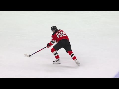 Jack Hughes scores a goal against the New York Rangers