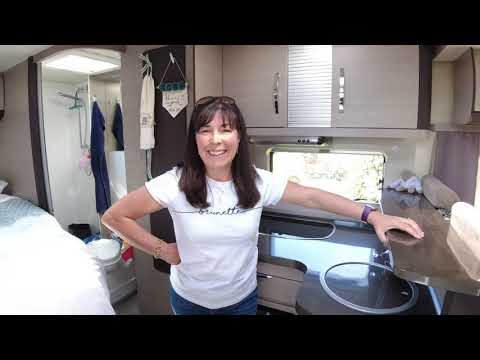 The Slaws arriving at a campsite and setting up the Motorhome