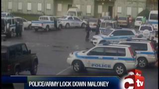 Police And Army Officers Lock Down Maloney Gardens