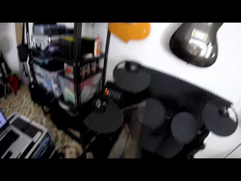 the Yamaha DTX400k or... a happy kid with his new toy :)