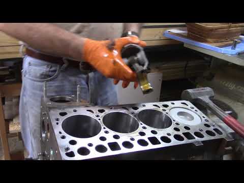 Installing Pistons in Diesel Engine