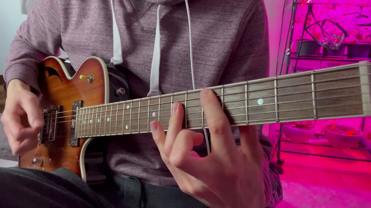 Close-up of a guitar fretboard playing the Seven Nation Army riff on a single string.