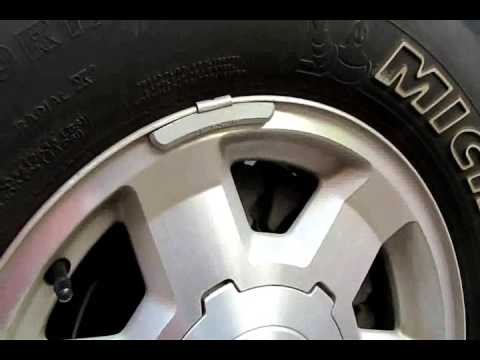 Part of a video titled How to check brake pads without removing wheel DIY - YouTube