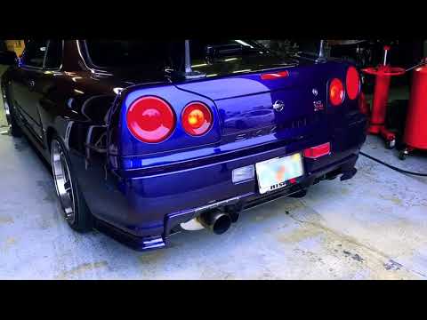 Midnight Purple Skyline R34 GTR Vspec gets a Tomei Ti Exhaust
