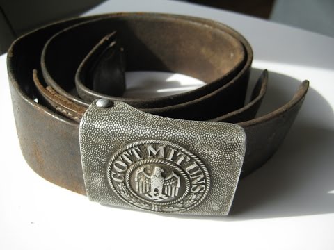 Hidden treasures of World War II - German belt buckle and grenade fuse