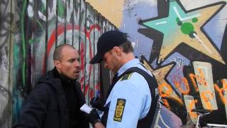 Police officer reprimanded by guerilla gardening activist @ Byhave 69, CPH