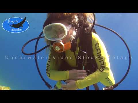 0494_female scuba diver with vintage scuba diving mask mask, HD underwater video stock footage