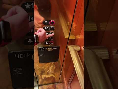 Beautiful gold Thyssenkrupp Aurora SVL 30 oildraulic elevator at The Shire building B