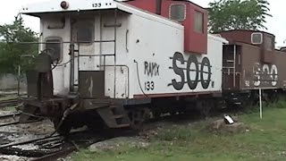 preview picture of video 'Soo cabooses, Amtrak mail cars on Fairfield, IA sidings 5/13/05'