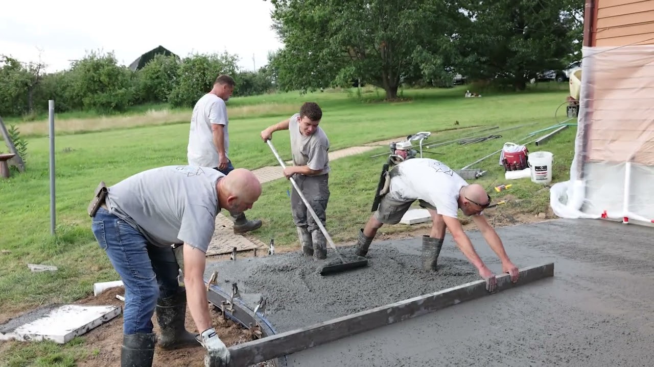 NG Masonry crew finishing a stamped concrete project