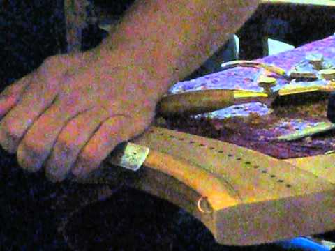 Shaping the neck of a small wire harp with high tech cordless tools. Pt. II