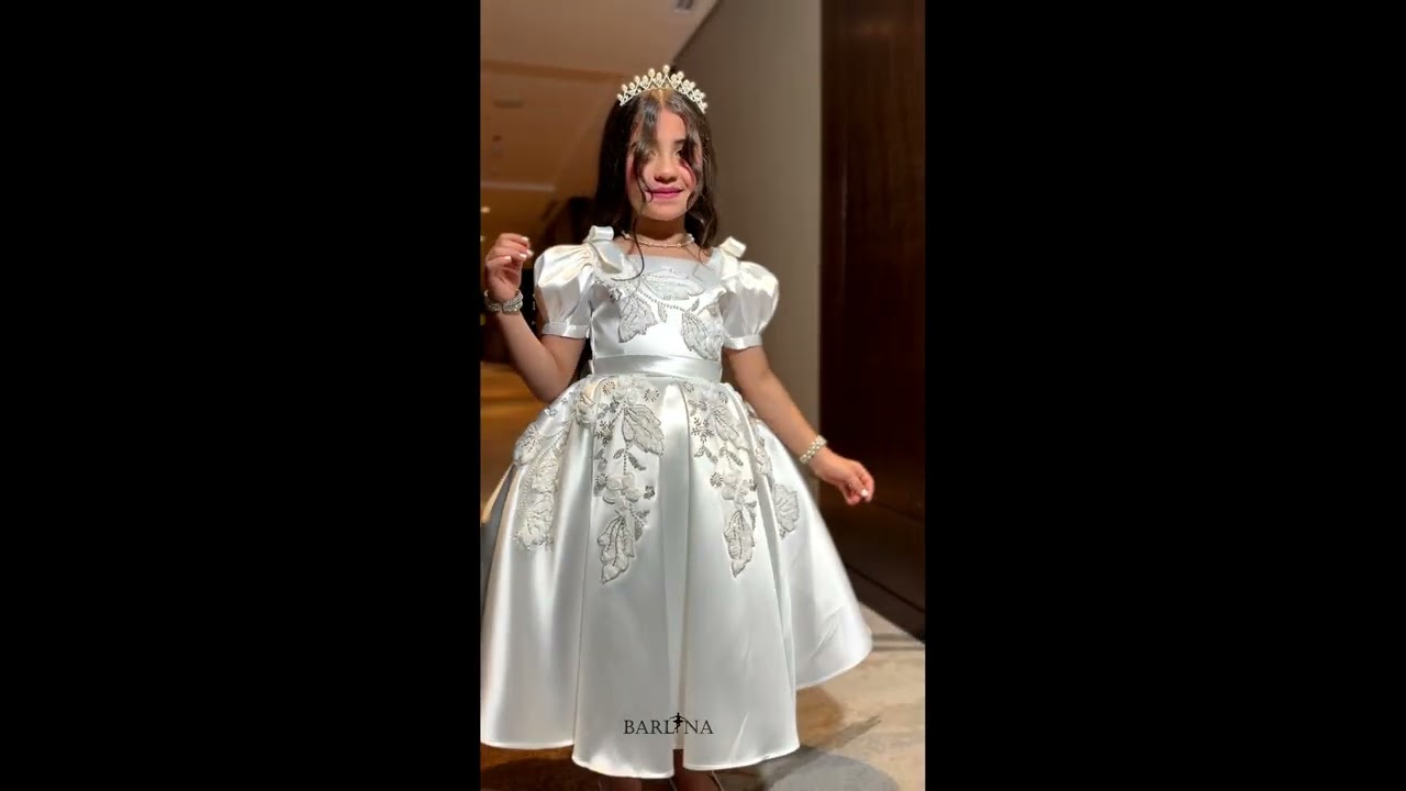 White girl's dress with embroidery on the chest - year 1