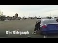 Fleeing suspect clings to moving car as high speed chase goes wrong