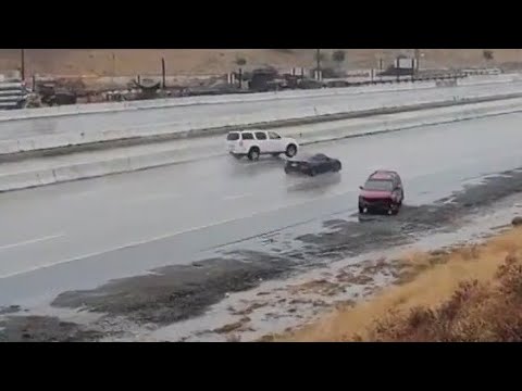 Speeding cars lose control on wet I-5