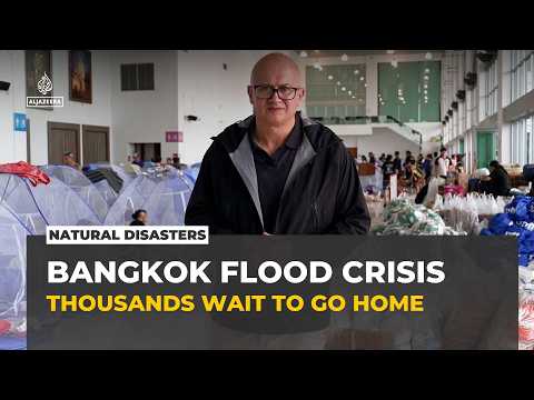 Bangkok floods displace thousands as waters remain slow to recede