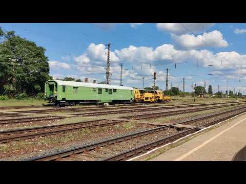 MAV Class V43 Locomotive 432-234 With a Passenger rake Crossing Rakos with a Plasser Movement across