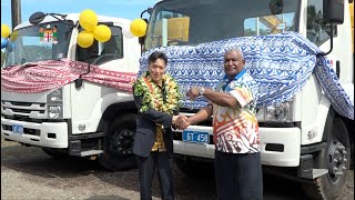 Fiji's Minister for Fisheries fficiates at the handing over of Excavators and Trucks