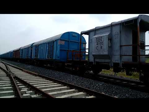 A honking, rushing Twin ALCO frieght train passes through Korutla Bridge