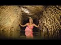 Watch This Bikini Clad Surfer Explore Catacombs Lined With Skulls