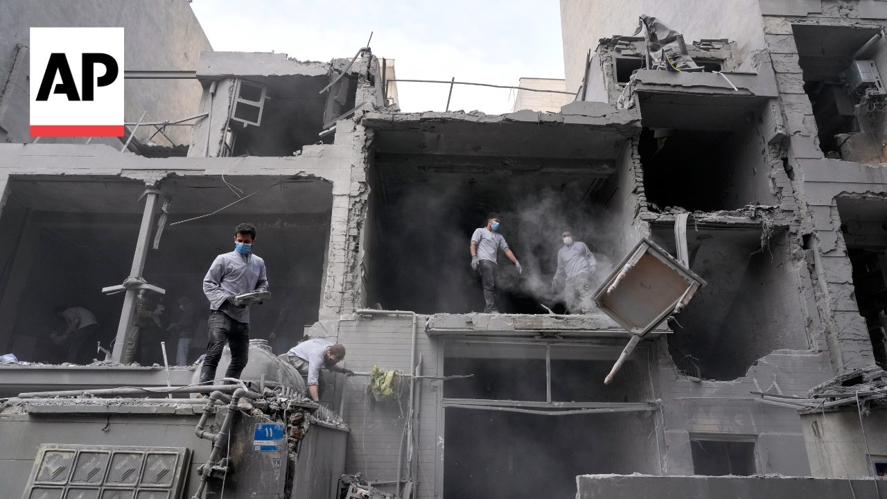 Video | Residents and workers clear debris after strikes in Tehran, Iran