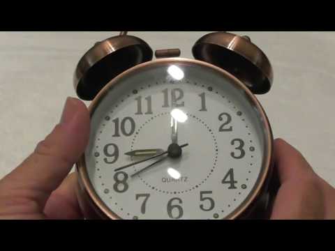Round golden metal alarm clock with night led display