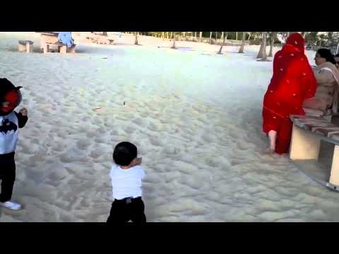 Ryan and hamdan playing on the beach