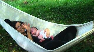 preview picture of video 'Infant and Mama in Hammock -- 1-Month-Old Newborn Baby Rooting for Milk'