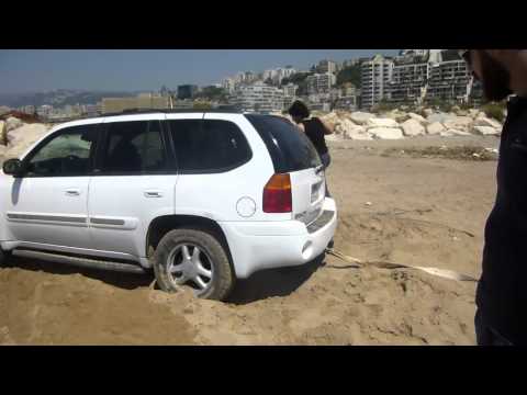 watch how Cherokee saves a GMC Envoy  stuck in Sand at Nahr El Kalb Beach