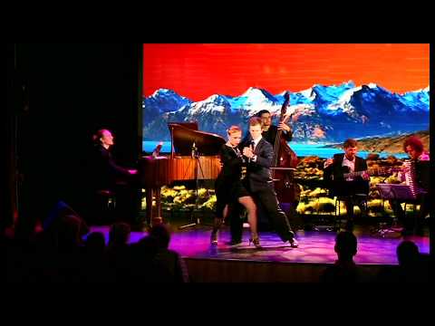  Ekaterina Koptelova  and  Rodion Khramutichev  are  dancing  to  a  tango  at  White Nights tango festival  in  2017