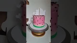 cocomelon theme 1st birthday cake in pink with whipped cream