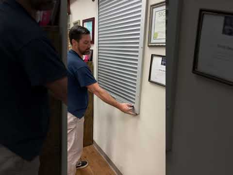 Security Shutter Covering Drive Through Window at Pharmacy