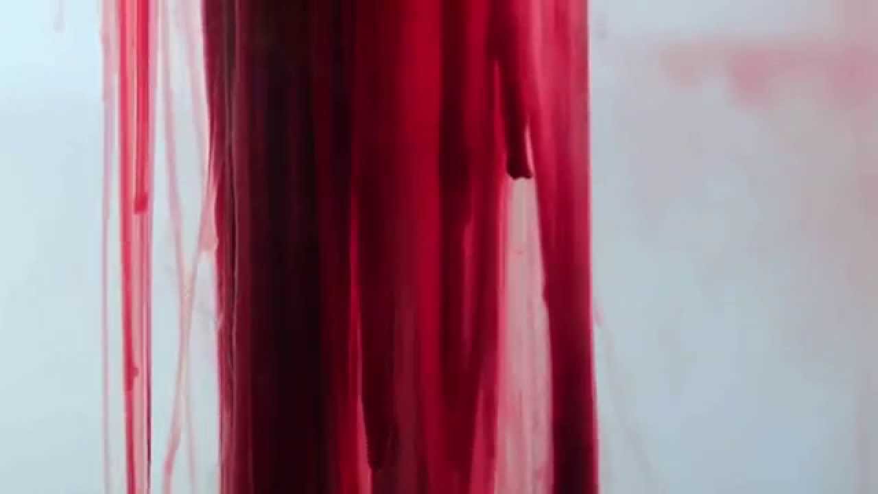 Red liquid dripping down a white wall, a visual metaphor from the documentary We Who Bleed (Vi som blöder). Photo: Zayera Khan.