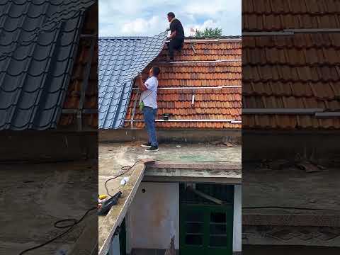 The leaking roof is laid with color steel tiles- Good tools and machinery make work easy