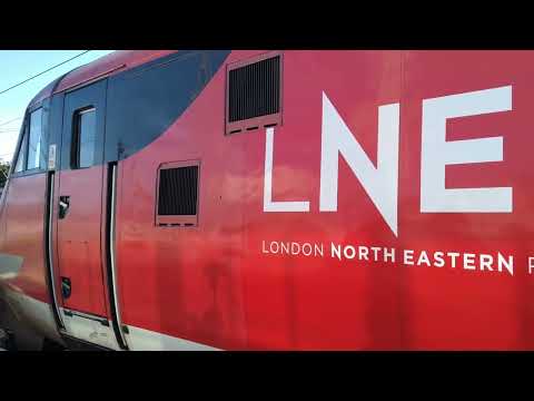 82225 departing Peterborough with a Class 319 initial whine