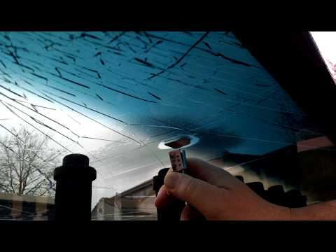 Part of a video titled How to remove rear view mirror mount from windshield - YouTube