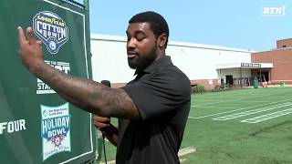 Darien Harris shows off MSU's Championship Wall