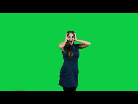 Happy excited girl pointing promoting in front of the green screen
