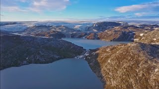 Scientists working in Greenland. The video describes the study's findings, showing that Greenland's ice loss rates in the 21st century could starkly outpace that of all prior centuries over the past 12,000 years.