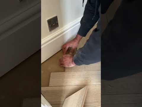 Watch this Greige Oak Laminate Herringbone Flooring
