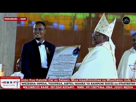 The composer of the song "MKATOLIKI" Brother Emil Shayo presents the song to Archbishop Ruwa'ichi...