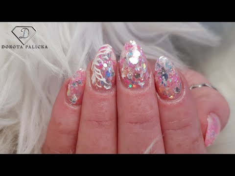 Salon Nails. Short almond shape gel nails on tips with glitter.