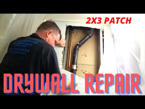 step-by-step process of patching a large hole in drywall after a plumber has repaired a drainpipe
