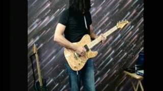 Tony Montana plays the Ed Roman Magic Twanger guitar