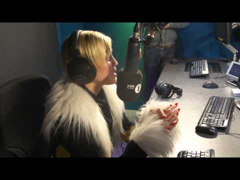 Greg James and ACTUAL Miley Cyrus on an ACTUAL Wrecking Ball