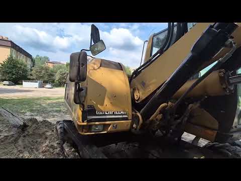 Caterpillar M 318 C, экскаваторы