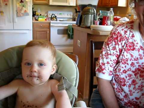 Henrietta has her first birthday cake.   MVI 0631