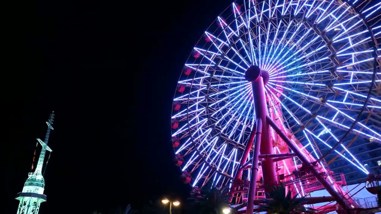 Glimpse of the illuminated Ferris wheel at Harborland.