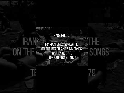 Iranian girls sunbathe on the beach and sing songs with a guitar.  Tehran.  Iran.  1979