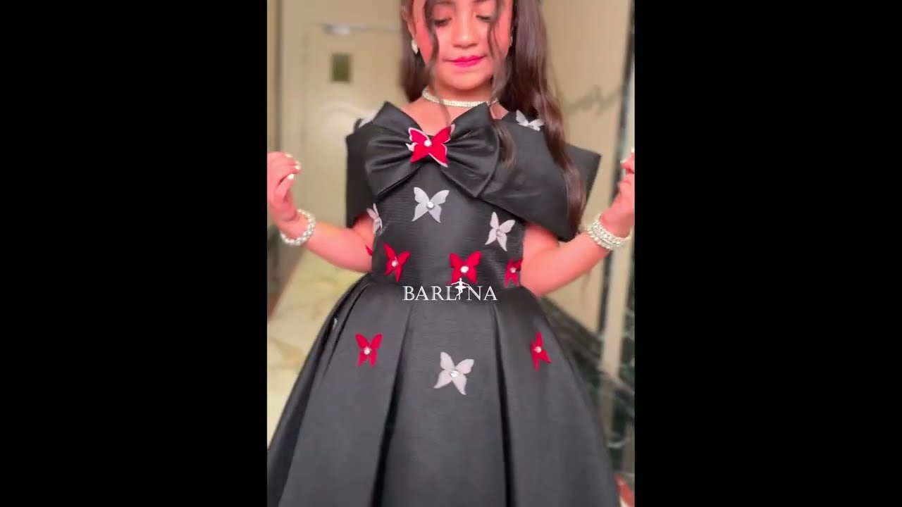 Girls' black off-shoulder dress with butterflies - year 1