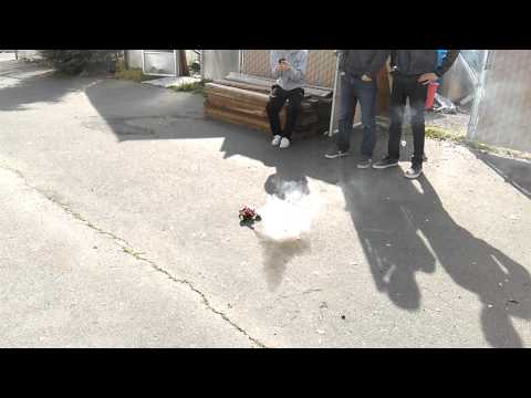 Homemade rocket strapped to two wheeled car